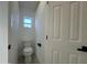 Small bathroom with toilet and single vanity at 8050 E Tuckey Ln, Scottsdale, AZ 85250