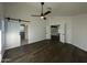 Bright bedroom with wood floors, barn door, and access to upper loft at 8050 E Tuckey Ln, Scottsdale, AZ 85250