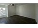 Simple bedroom with dark wood floors and a large window at 8050 E Tuckey Ln, Scottsdale, AZ 85250