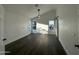 Spacious bedroom with dark wood floors, ceiling fan, and barn door at 8050 E Tuckey Ln, Scottsdale, AZ 85250