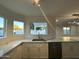 Kitchen features marble countertops and a farmhouse sink at 8050 E Tuckey Ln, Scottsdale, AZ 85250