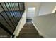 Modern staircase with metal railing and wood steps at 8050 E Tuckey Ln, Scottsdale, AZ 85250