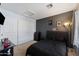 Bedroom featuring a black comforter and large closet at 1041 W Chilton Ave, Gilbert, AZ 85233