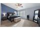 Main bedroom with a king-size bed and ample natural light at 1041 W Chilton Ave, Gilbert, AZ 85233