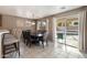 Bright dining room with sliding glass doors opening to the backyard and pool at 1041 W Chilton Ave, Gilbert, AZ 85233