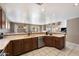 Open concept kitchen with island, stainless steel appliances, and views to the living room at 1041 W Chilton Ave, Gilbert, AZ 85233