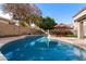 Relaxing kidney-shaped pool surrounded by a spacious backyard at 1041 W Chilton Ave, Gilbert, AZ 85233