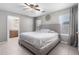 Spacious main bedroom with ceiling fan and en-suite bathroom access at 12640 W Florence St, Avondale, AZ 85323