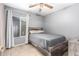 Cozy bedroom with ceiling fan and wood-toned bed frame at 12640 W Florence St, Avondale, AZ 85323