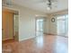 Bedroom with sliding glass doors to the outside and mirrored closet doors; neutral paint and light hardwood flooring at 524 S Allred Dr, Tempe, AZ 85288