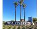 Mesa Riverview sign with palm trees and landscaped bed, under a clear blue sky at 524 S Allred Dr, Tempe, AZ 85288