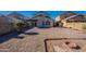 Backyard view of house with gravel and landscaping at 7313 N 69Th Ave, Glendale, AZ 85303