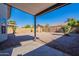 Landscaped backyard with gravel and covered patio at 7313 N 69Th Ave, Glendale, AZ 85303