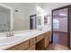 Bright bathroom features double sinks, a vanity with storage, and a separate tub and shower at 7313 N 69Th Ave, Glendale, AZ 85303