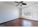 Charming bedroom with wood floors, built-in shelving, and a ceiling fan at 7313 N 69Th Ave, Glendale, AZ 85303