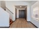 Bright entryway with wood-look tile floor and staircase at 7313 N 69Th Ave, Glendale, AZ 85303