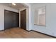 Clean entryway with wood-look tile flooring and two doors at 7313 N 69Th Ave, Glendale, AZ 85303