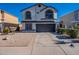 Two-story house with a two-car garage and landscaped front yard at 7313 N 69Th Ave, Glendale, AZ 85303