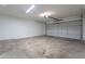 Spacious garage with overhead door and ample storage space at 7313 N 69Th Ave, Glendale, AZ 85303