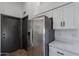 Stainless steel refrigerator in updated kitchen at 7313 N 69Th Ave, Glendale, AZ 85303