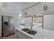 Modern kitchen with stainless steel appliances and white cabinets at 7313 N 69Th Ave, Glendale, AZ 85303