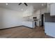 Modern kitchen with white cabinets and stainless steel appliances at 7313 N 69Th Ave, Glendale, AZ 85303