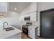 Modern kitchen with white cabinets and stainless steel appliances at 7313 N 69Th Ave, Glendale, AZ 85303