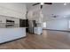 Modern kitchen with white cabinets and stainless steel appliances at 7313 N 69Th Ave, Glendale, AZ 85303