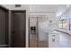 Modern kitchen with stainless steel refrigerator and white cabinets at 7313 N 69Th Ave, Glendale, AZ 85303