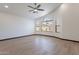 Living room with large window and wood-look tile floors at 7313 N 69Th Ave, Glendale, AZ 85303