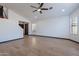 Bright living room with wood-look floors and a ceiling fan at 7313 N 69Th Ave, Glendale, AZ 85303