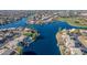 Aerial view of lakefront property with waterfront homes and boats at 1108 W Mango Dr, Gilbert, AZ 85233