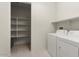 Laundry room with washer, dryer and shelving at 26535 W Ponderosa Ln, Buckeye, AZ 85396