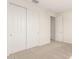 Bright bedroom featuring neutral walls, carpet, and closet at 2848 N Evergreen St, Buckeye, AZ 85396