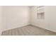 Neutral-toned bedroom featuring carpet, a window, and light colored walls at 2848 N Evergreen St, Buckeye, AZ 85396