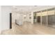 Spacious open-plan living and kitchen area with sliding glass doors and modern wood-look flooring at 2848 N Evergreen St, Buckeye, AZ 85396