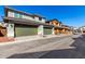 A street view featuring well-maintained homes, each equipped with a two-car garage and inviting landscaping at 2848 N Evergreen St, Buckeye, AZ 85396