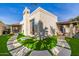 Stunning backyard with artificial turf, stone pathways, and a charming desert landscape at 629 E Myrtle Ave, Phoenix, AZ 85020