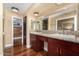 Elegant bathroom with a double vanity, granite countertops, and ample storage at 629 E Myrtle Ave, Phoenix, AZ 85020