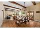 Charming dining area with wood beams, chandelier lighting, and terracotta tile flooring at 629 E Myrtle Ave, Phoenix, AZ 85020