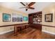 Spacious home office features custom built-ins, ample lighting, and hardwood floors at 629 E Myrtle Ave, Phoenix, AZ 85020