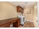 Laundry room featuring a desk area and front-loading washer and dryer at 629 E Myrtle Ave, Phoenix, AZ 85020