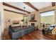 Bright living room boasts hardwood floors, a fireplace, and expansive windows at 629 E Myrtle Ave, Phoenix, AZ 85020