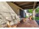 Covered patio featuring a cushioned outdoor sofa and stylish decor at 629 E Myrtle Ave, Phoenix, AZ 85020