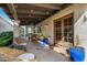 Covered patio featuring travertine tile, comfortable seating, and outdoor dining area with pool views at 629 E Myrtle Ave, Phoenix, AZ 85020