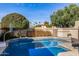 Backyard pool with basketball hoop, landscaping and neighborhood view at 629 E Myrtle Ave, Phoenix, AZ 85020