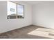 Spacious bedroom with carpet and window overlooking the neighborhood at 7280 E White Tail Rd, San Tan Valley, AZ 85143