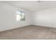 Spacious bedroom with neutral carpeting and large window at 7280 E White Tail Rd, San Tan Valley, AZ 85143