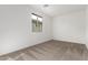 Simple bedroom with neutral carpeting and window at 7280 E White Tail Rd, San Tan Valley, AZ 85143