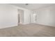 Bright bedroom with carpet flooring and access to hallway at 7280 E White Tail Rd, San Tan Valley, AZ 85143